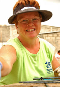 Susi smiling while working on Habitat site