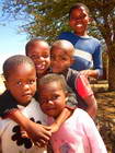 Children posing near the Habitat for Humanity office in Mahalapye
