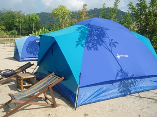 Blue tent with two lounges