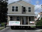 Moving completed house from State Fairgrounds to its neighborhood