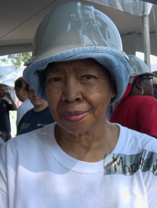 Older African American woman wearing a hard hat