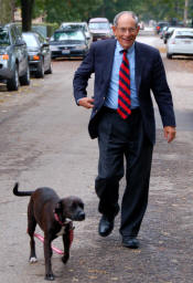 Man in a business suit walking down the street